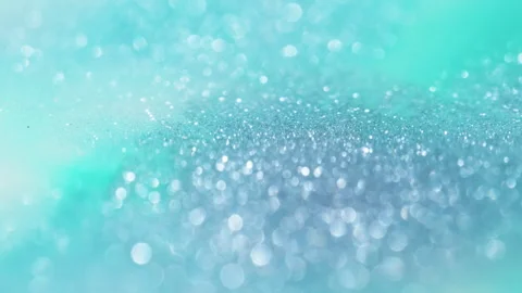 Macro bokeh of shimmering glitter particles in vibrant fluid motion Stock Footage 331753954