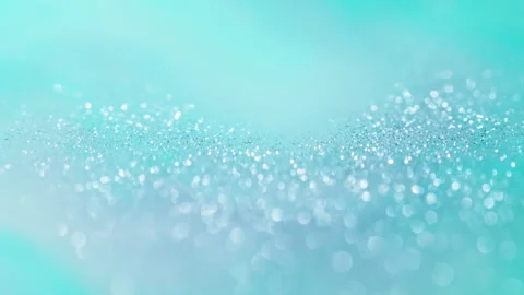 Macro bokeh of shimmering glitter particles in vibrant fluid motion Stock Footage 331754871