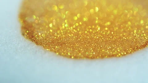 Macro bokeh of shimmering glitter particles in vibrant fluid motion Stock Footage 331757671