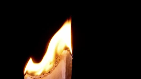 Macro Bright Yellow Flame Consuming Thick Paper Edge Over Black Background 库存影片 330301330