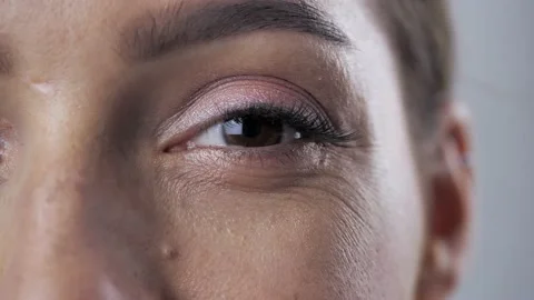 Macro: brunet woman's Eye Close-up Feeling 4k Video stock 144745043