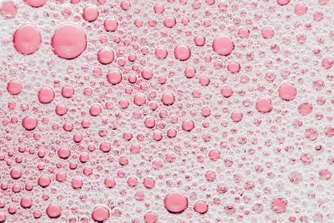 Macro bubble of pink water background, transparent bath soap Stock Photos