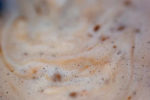 Macro bubbles of black coffee foam Stock Photos
