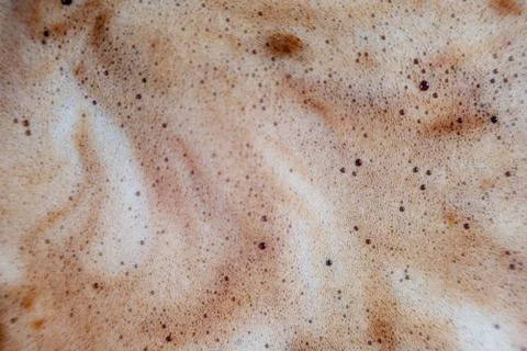 Macro bubbles of black coffee foam Stock Photos