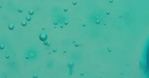 Macro Bubbles moving in green/blue atmosphere 17b 스톡 동영상 188434162