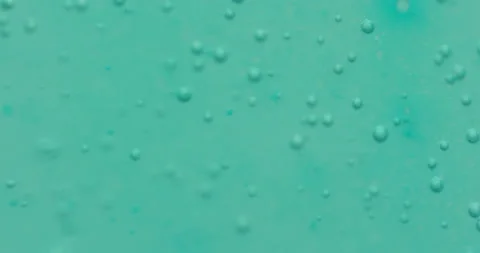 Macro Bubbles moving in green/blue atmosphere 18b 스톡 동영상 188434900