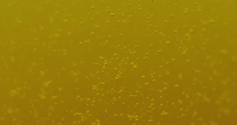 Macro Bubbles moving  in yellow/orange atmosphere 3a 스톡 동영상 188430940