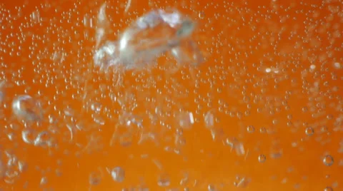 Macro bubbles of water on orange background Stock Footage 36543781