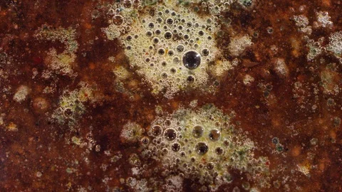 Macro bubbling dark red lava planet surface bubbling texture background Stock-Footage 118280677