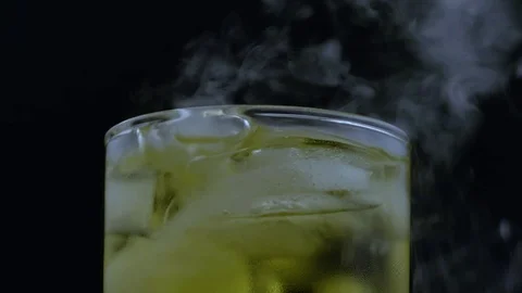 Macro bubbling smoking iced beverage Video stock 70705445