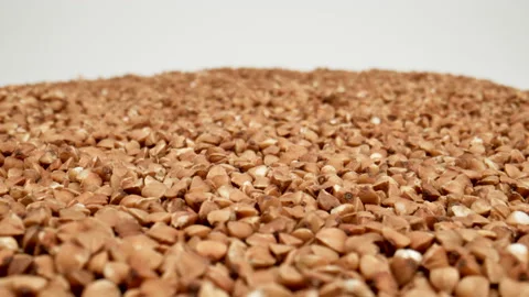 MACRO: Buckwheats on a white background. Dolly motion Vídeos de archivo 166029434