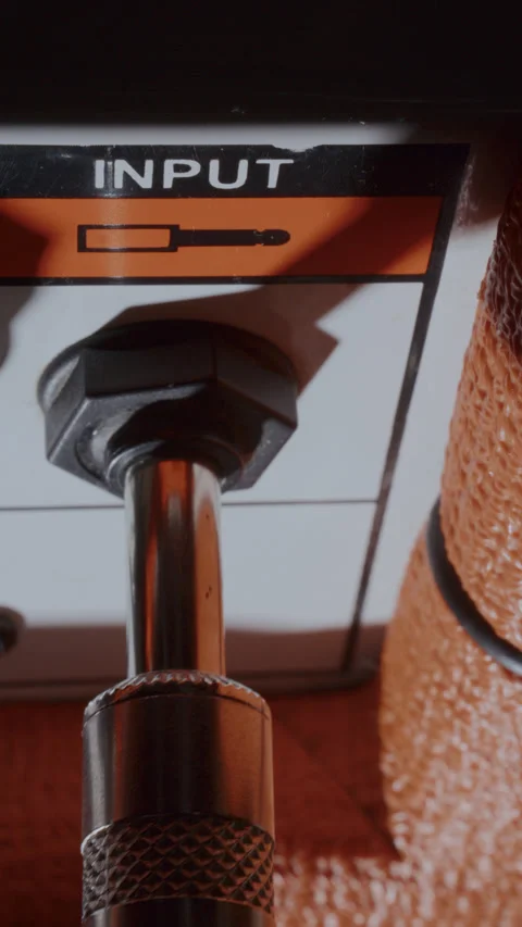 Macro of Cable Plug Being Inserted into Amplifier Input Socket Stock Footage 342454437