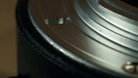 Macro camera lens rotates Stock Footage 100023094