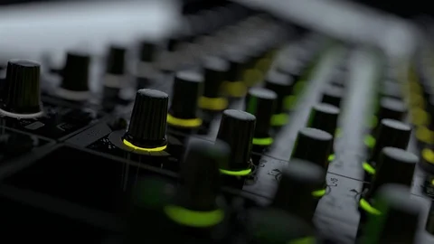 Macro camera move from side to right on Dj mixer with moving sliders and buttons 库存影片 97397909