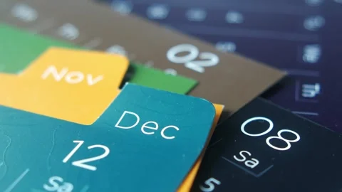 Macro camera movement over colorful paper calendar pages showing november a.. Stock Footage 332858323