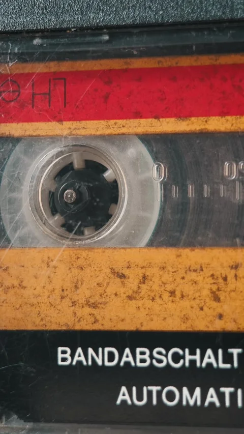 Macro Cassette Reel Spin German Text Stock Footage 317762634