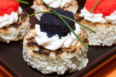 Macro of caviar canapés Фото