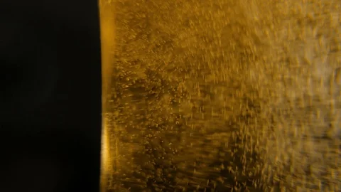 Macro Of Champagne Or Sparkling Wine Being Pored Into The Glass Video stock 100201482
