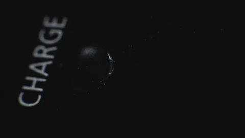 Macro, charge indicator, light bulb blinks, looped. Recharging batteries of dslr Stockbeeldmateriaal 129744309