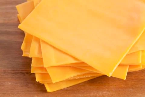 Macro cheddar cheese Stock Photos