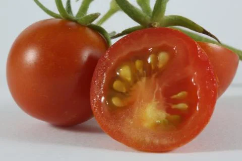 Macro cherry tomato slice Stock Photos
