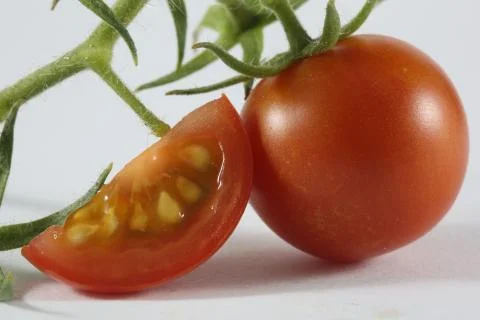 Macro cherry tomato slice Stock Photos