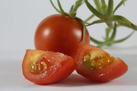 Macro cherry tomato slices Stock Photos