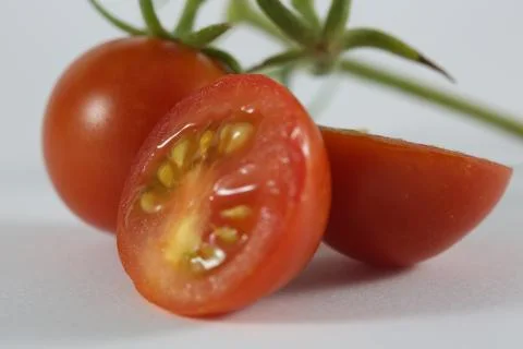 Macro cherry tomato slices Stock Photos