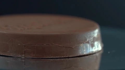 Macro chocolate bar, fluffy waffle, hazelnut crunch cookie on a rotating plate Stock Footage 304860163