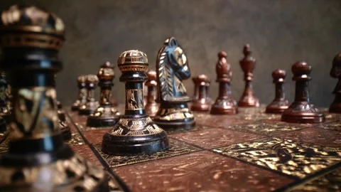 Macro cinematic shot of ornate chess pieces standing on luxury wooden board.. Stock Footage 337348651