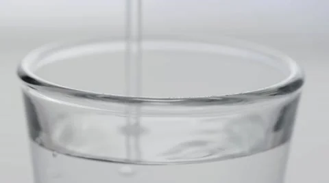 Macro clear shot pour and grab Stock Footage 68003053