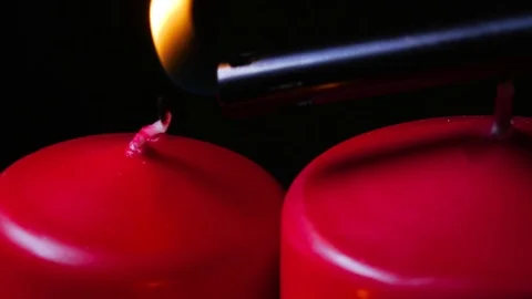 Macro close up of 2 lit candles and another with no flame Stock-Footage 70240772