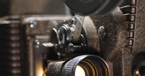 Macro close up of 8mm film strip tape going through an old vintage analog Vídeo Stock 249163027