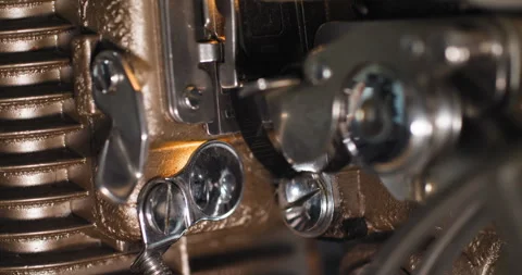 Macro close up of 8mm film strip tape going through an old vintage analog Vídeo Stock 249163321