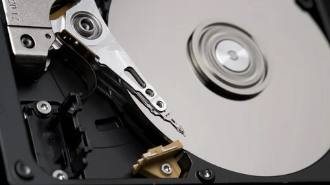 Macro, Close-Up of Actuator Arm of Computer Hard Disk Drive in Work. 4k Stock Footage 129518651