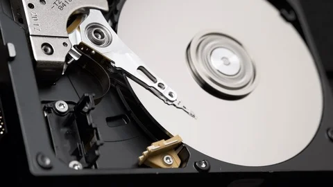Macro, Close-Up of Actuator Arm of Computer Hard Disk Drive in Work. Slow Motion Stock Footage 129607444