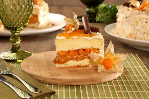 Macro close up of appetizing slice of white chocolate cake with nut and Physa Stock Photos