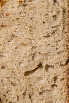 Macro Close-Up of Artisan Bread Crumb Structure in Harsh Lighting Stock Photos