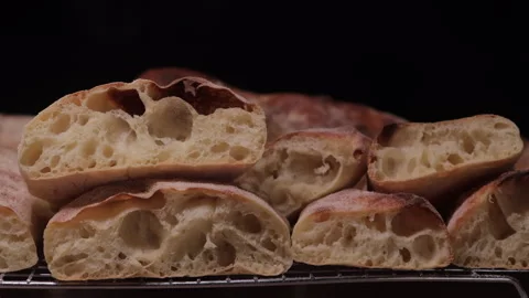 Macro close-up of artisan bread loaf showing crust and crumb texture. Low key Stock Footage 331207665