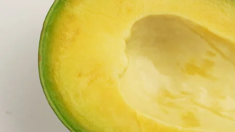 Macro Close Up Avocado Half Without Seed Rotating 4K Stock Footage 322084076