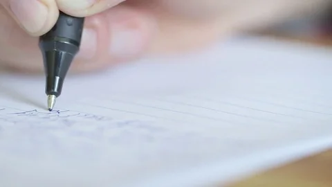 Macro close up of ballpoint pen writing a letter or essay on lined paper. Vídeos de archivo 79835447