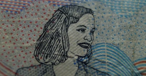 Macro close-up of banknote portrait with fine security patterns and vibrant Stock Footage 314886158