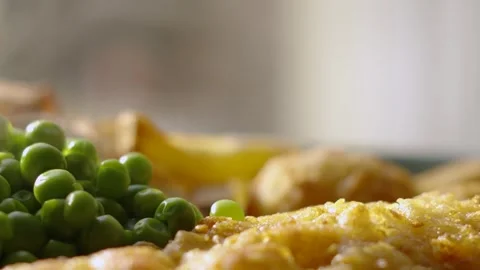 Macro Close Up of Battered Cod Fish with British Garden Peas and French Stock Footage 283343749