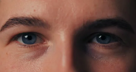 Macro close-up on beautiful blue iris eyes looking straight into the camera Stock Footage 229278192