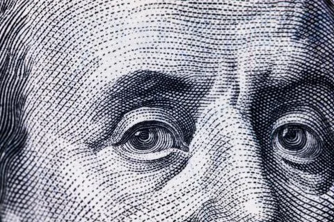 Macro close up of Ben Franklin's face on the US $100 dollar bill. Stock Photos