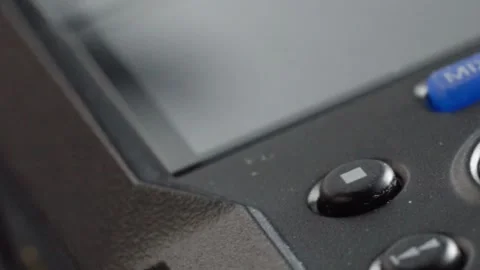 Macro Close Up of Black Electronic Control Panel With Red Button and Blue Stock Footage 346293665