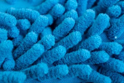 Macro close up of blue chenille microfiber texture for cleaning, trapping dus Stock Photos