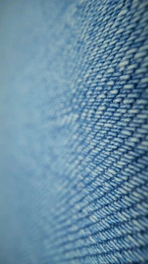 Macro close-up of blue denim fabric revealing detailed weave Video stock 342085296