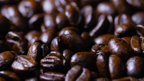 Macro close up brown coffee beans rotating around 5 Stock Footage 70239910