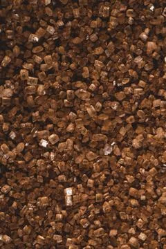 Macro close up of brown sugar, selective focus Stock Photos